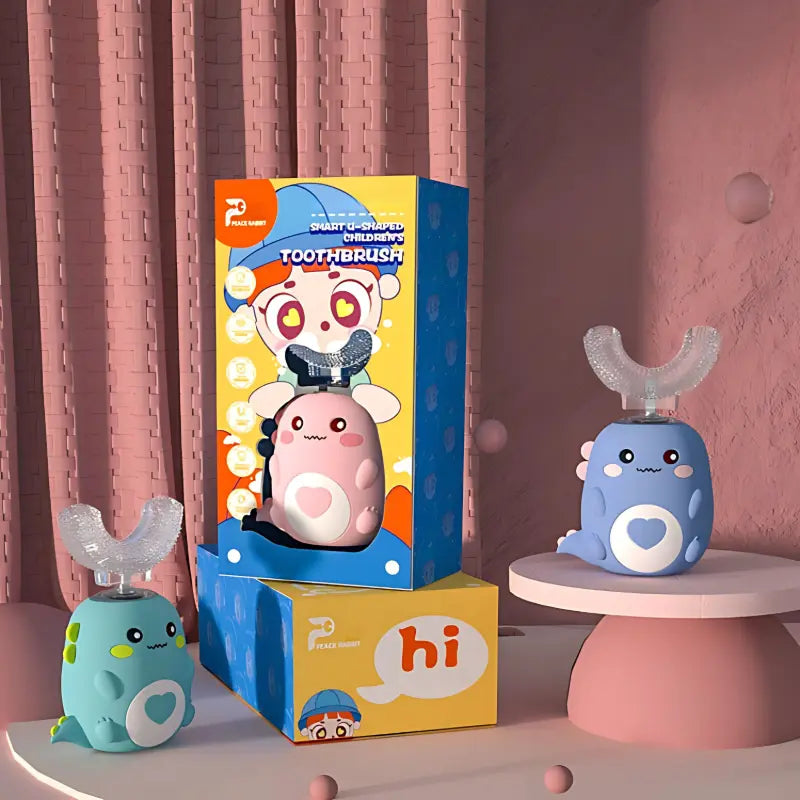 Set of three (blue, pink and green) colorful dinosaur-shaped children's U-shaped electric toothbrushes with packaging displayed on a pink background.